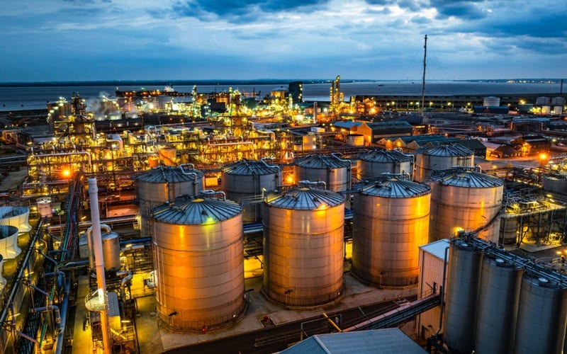 Industrial lubricant storage facility at dusk